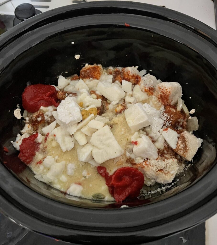 A slow cooker with curried ingredients