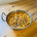 Slow Cooker Chicken Korma in a balti dish