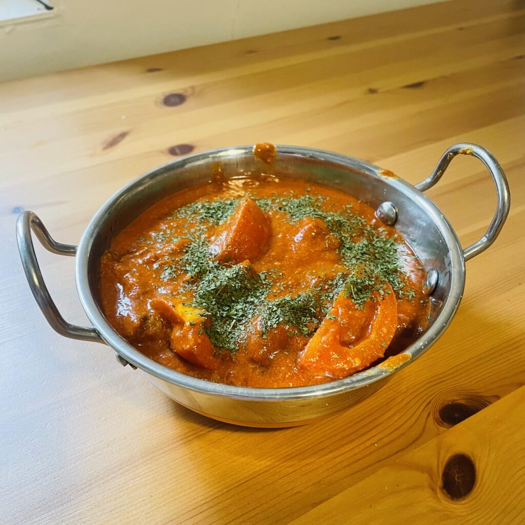 Slow Cooker Lamb Korma in a balti dish